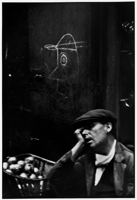 SPAIN. Barcelona. Barrio Chino. 1933. The narrow street of Barcelona's roughest quarter is the home of prostitutes, petty thieves and dope peddlers. But I saw a fruit vendor sleeping against a wall and was struck by the surprisingly gentle and articulate drawing scrawled there.